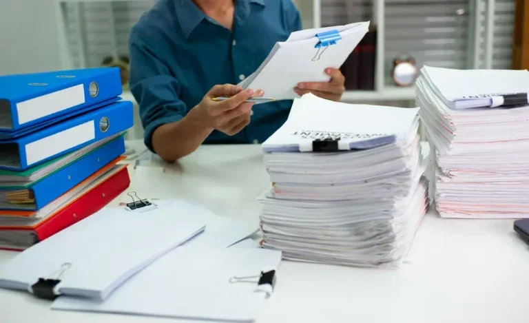 Stacks of papers on desk