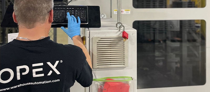 OPEX worker working on a machine