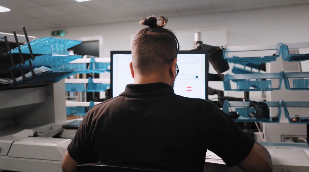 Associate working at a computer