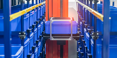 plastic boxes in the cells of the automated warehouse