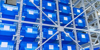 Plastic totes in the cells of the automated warehouse